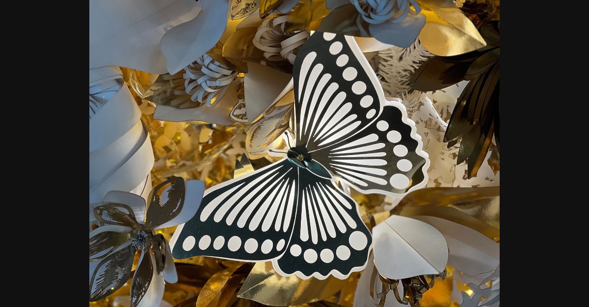 An example of laser cutting for high-end retail shops - a gold butterfly on Dior's Christmas display
